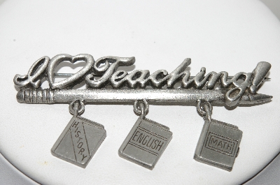 +MBA #E44-063   "JJ Jonette Jewelry Co.  Silvertone "I Love Teaching" Pin With Attached Book Charms