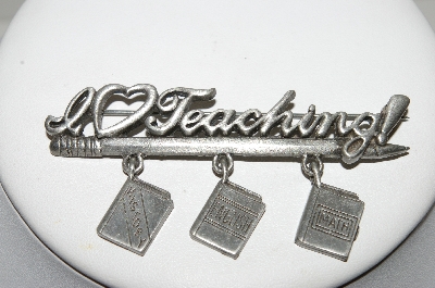 +MBA #E44-063   "JJ Jonette Jewelry Co.  Silvertone "I Love Teaching" Pin With Attached Book Charms