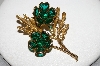 **MBA #E46-073   "Vintage Goldtone Green Glass Stone Flower Pin"