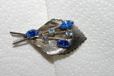 **MBA #E50-098   "Vintage Silvertone Blue Crystal Rhinsetone Leaf Pin"