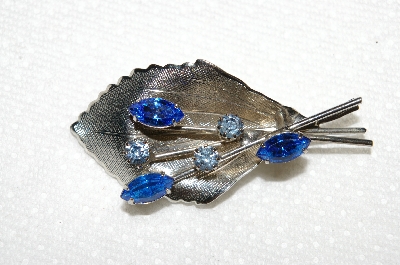 **MBA #E50-098   "Vintage Silvertone Blue Crystal Rhinsetone Leaf Pin"