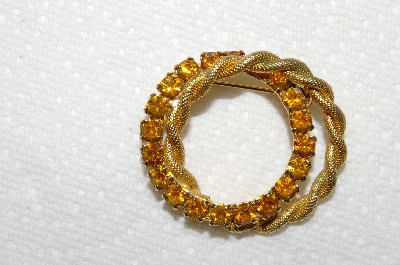 **MBA #E52-132   "Vintage Gold Plated Citrine Colored Rhinestone Double Circle Pin"