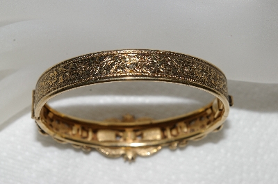 +MBA #E52-206   "Avon Antiqued Goldtone Purple Rhinestone Hinged Cuff Bracelet"