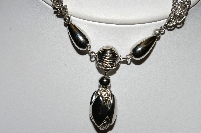 +MBA #E51-370   "Vintage Silvertone Fancy Three Strand Necklace"