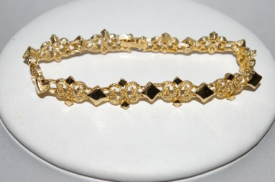 +MBA #E51-385   "Avon Gold Tone Fancy Link Bracelet"
