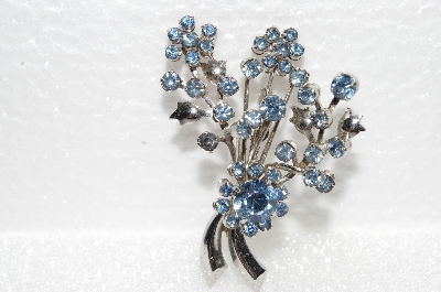 **MBA #E56-003   "Vintage Silvertone Blue Crystal Rhinestone Fancy Flower Pin"