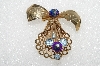 **MBA #E56-010   "1940's Bow Brooch With Marguerita Cut Two-Tone Stones"