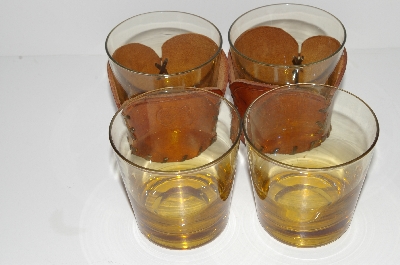 +MBA #S28- 233   "Set Of 4 Amber Glass Tumblers With Hand Tooled Leather Drink Holders"