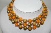 +MBA #88-063  "Unsigned Vintage Wood & Acrylic Three Strand Necklace"