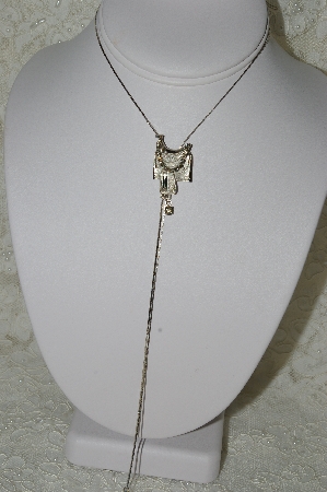 +MBA #86-058  "Silvertone Rhinestone Saddle Bolo Necklace"