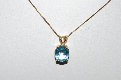 +MBA #87-221  "14K Yellow Gold Set Oval Blue Topaz Pendant With 16" Chain"