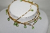 +MBA #89-045  "Gold Tone Green Glass Faceted Stone Necklace"