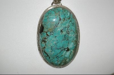 +MBA #7599   Oval Shaped Blue Turquoise Pendant