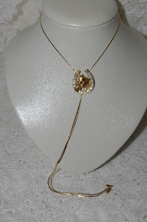 +MBAMG #25-189  "Goldtone Rhinestone Horseshoe Bolo Necklace"