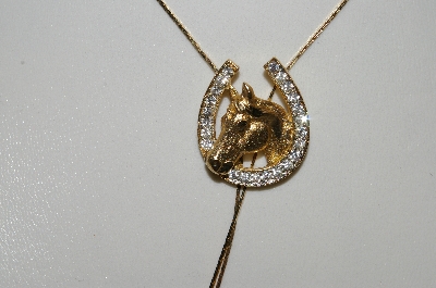 +MBAMG #25-189  "Goldtone Rhinestone Horseshoe Bolo Necklace"